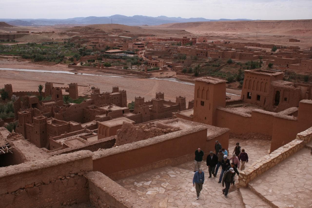 Chakib Mobtassim with Travelers in Marrakech Souk - ChakibTours